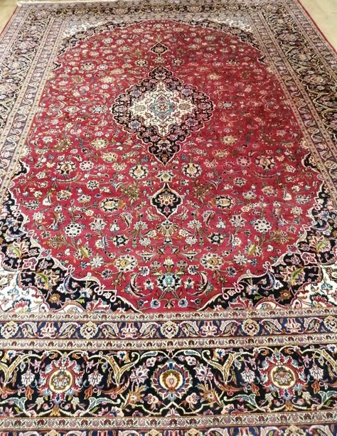 A North West Persian red ground carpet Approx. 420 x 300cm